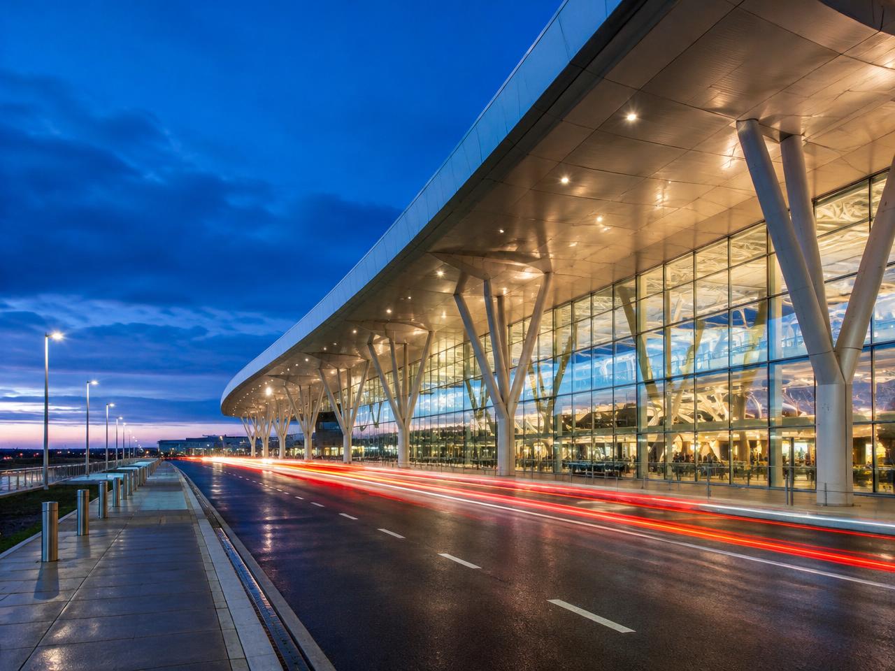 Airport terminal curbside at blue hour